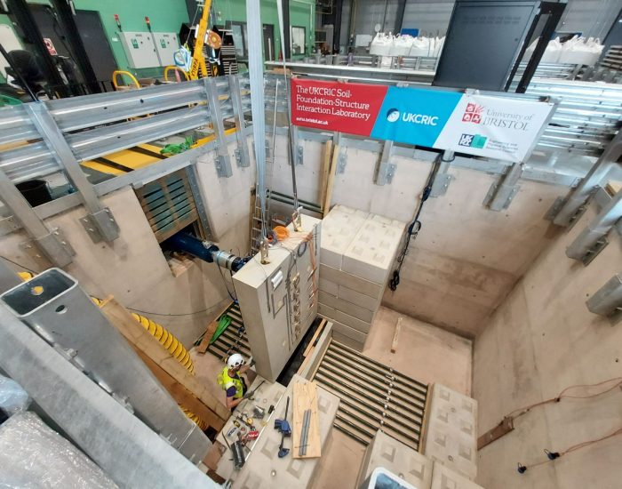 A 4m deep pit, with precast concrete blocks being positioned to form a retaining wall